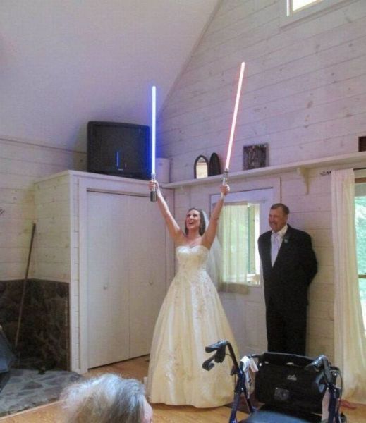 bride holding two light sabers, marriage, wedding, wtf, star wars
