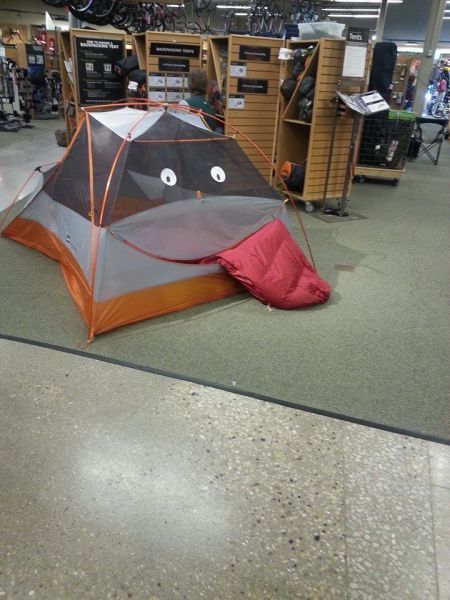 tent with googley eyes eating sleeping bag