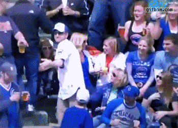 baseball fan spills beer while throwing ball