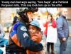 young man had sign saying free hugs at a portland ferguson rally, this cop took him up on the offer, beautiful moment