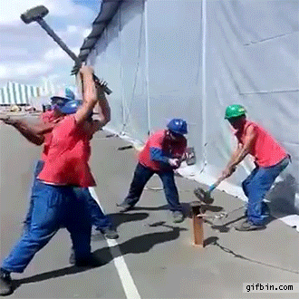 four guys hammering a post, perfectly looped gif