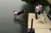perfectly timed photo of a guy falling onto water