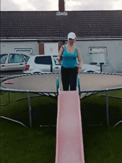 girl jumps from trampoline onto slide and it explodes, fail