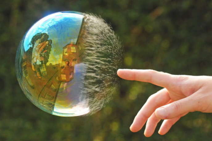perfectly timed photo of a half popped bubble
