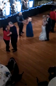 kid dances on the floor at a wedding, wtf