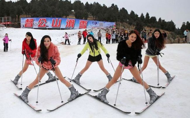 a group of girls skiing in short shorts