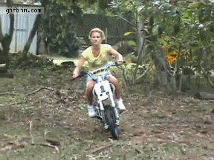 girl on motorcycle wipes out off a jump