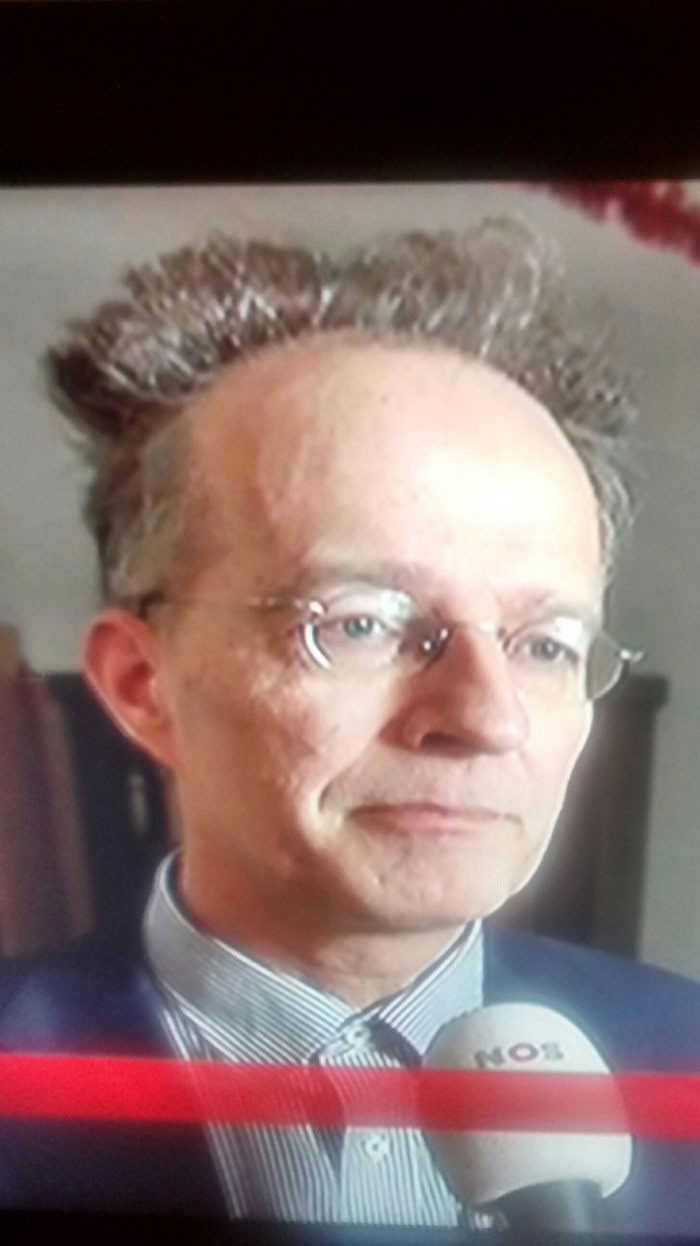 watching tv when suddenly this guy and his hair appear