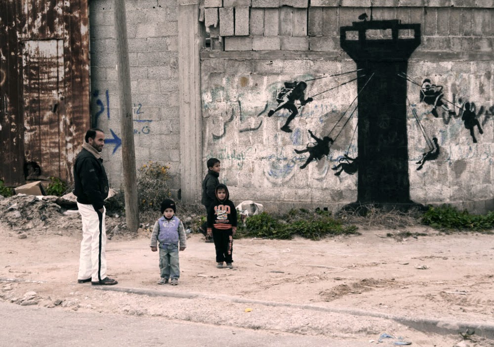 banksy unveils a new series of pieces in gaza palestine