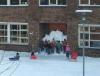 this is how i remember child hood, kids pile tons of snow in front of school doors
