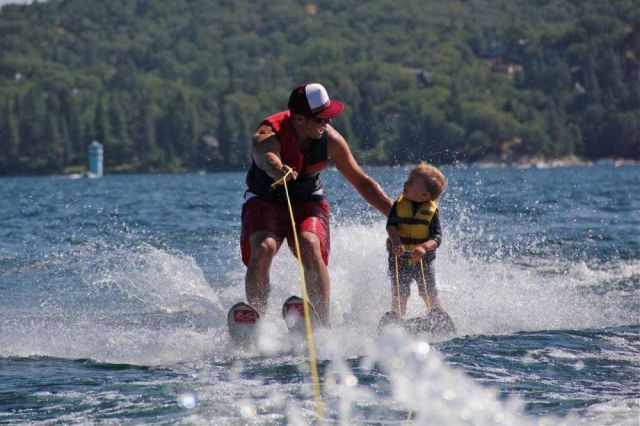 father and son water skiing