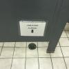 this is not a urinal, drain in bathroom floor, sign