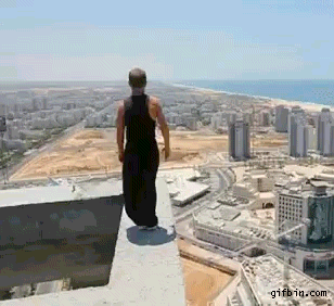 kid does back flip on high open structure and almost falls to his death