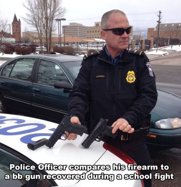 police officer compares his firearm to a bb gun recovered during a school fight
