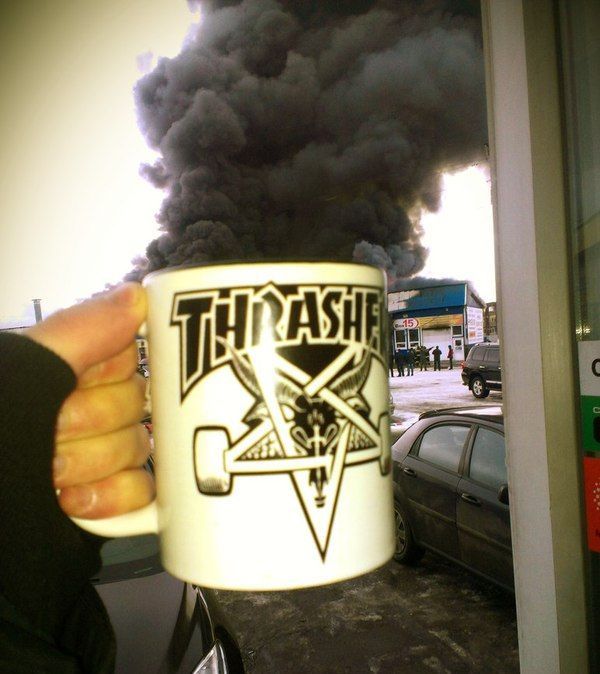 billowing black smoke coming out of a thrasher mug