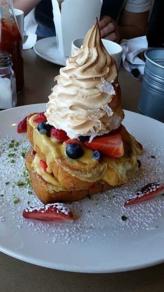 i try to eat healthy for breakfast, french toast with whipped cream and fruits