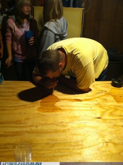 some guy snorting coke off a table