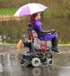 woman in purple ones riding wheelchair of bondage, wtf