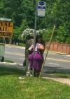 worst way to rest on a poll ever, butt cheeks surround sign post, fat ass, wtf