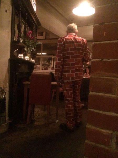 when your clothes match the walls, brick print pattern jacket, poorly dressed