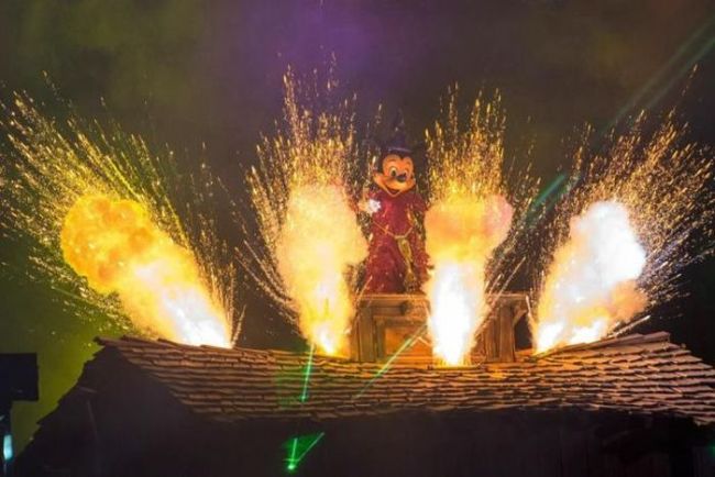 mickey house surrounded by explosions and lasers, wtf