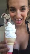 dog photobombs girl with ice cream cone