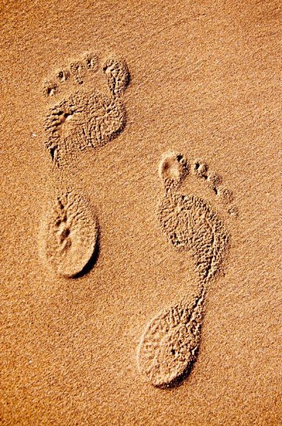 reverse foot prints in sand