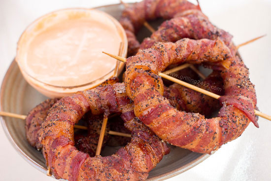 smoked bacon wrapped onion rings with sriracha mayo dipping sauce