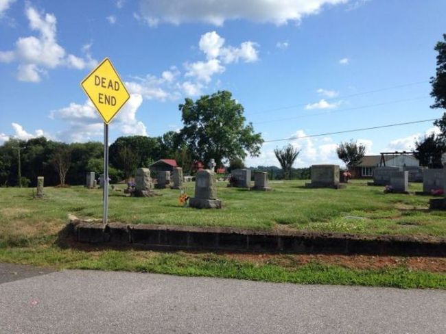 dead end at the cemetery, appropriate sign