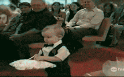 little boy throws pillow with ring on it at the bride and groom, lol, wedding fail