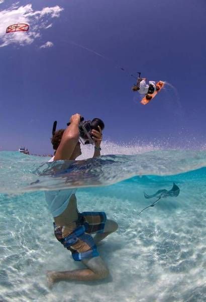awesome photo of a photographer photographing a kite boarder with a stingray between them