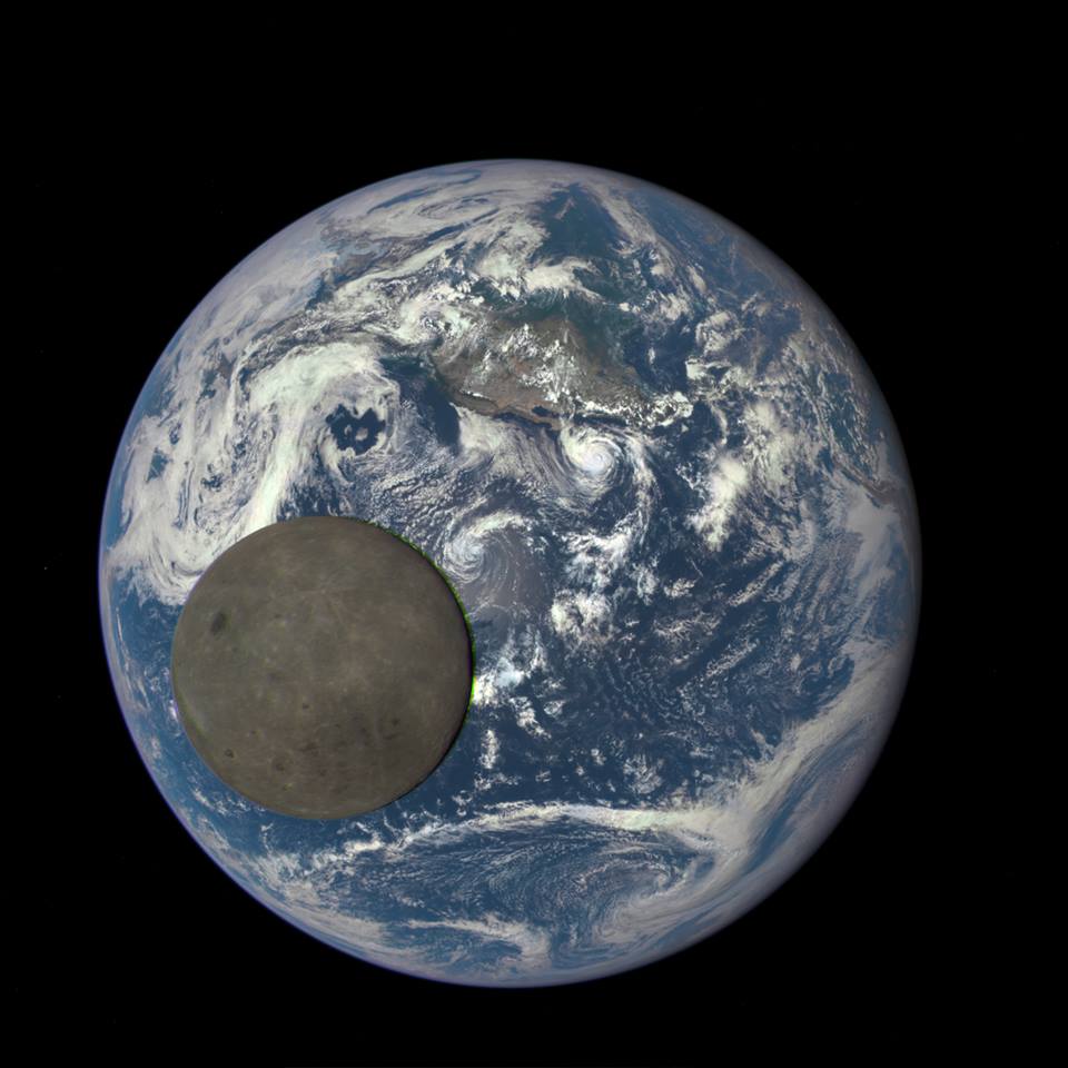 space photograph of the moon crossing the earth