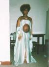 worst prom dress ever, pregnant high schooler shows off her stomach, poorly dressed
