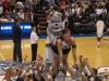 awkward cheerleading moment, bulldog mascot mounts cheerleader in air at basketball game