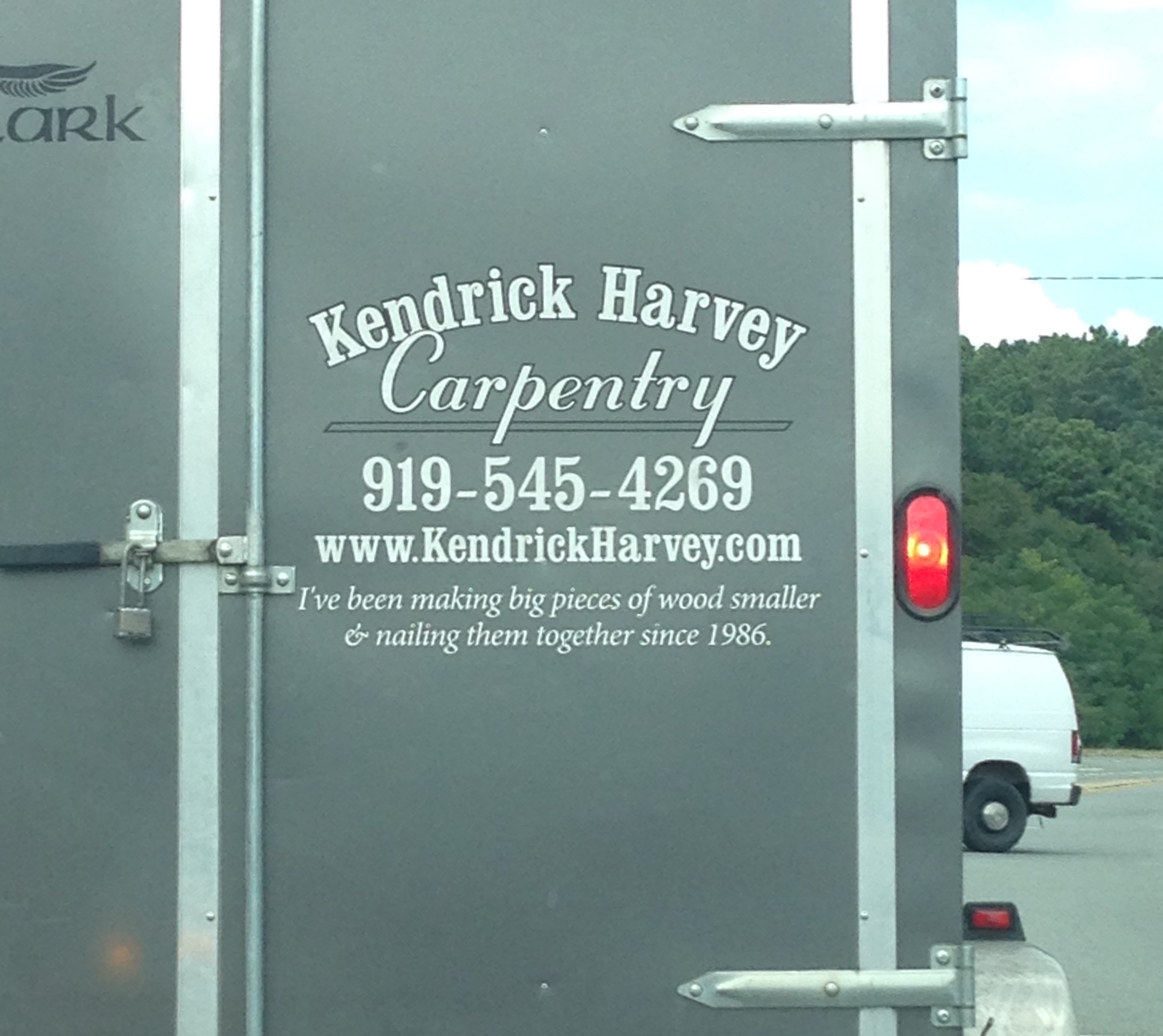 i've been making big pieces of wood smaller and nailing them together since 1986, kendrick harvey carpentry, company text on truck