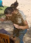 yep that's a beehive, girl covered in bees