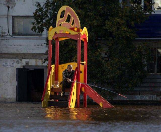 fishing from a playground structure during a flood