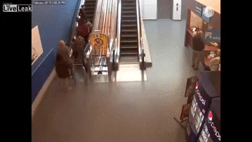 motorcycle chase in the mall, bike goes down escalator followed by cop