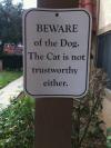 beware of the dog, the cat is not trustworthy either, funny sign
