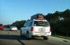 honk for grandma, coffin on roof of suv on the highway, wtf