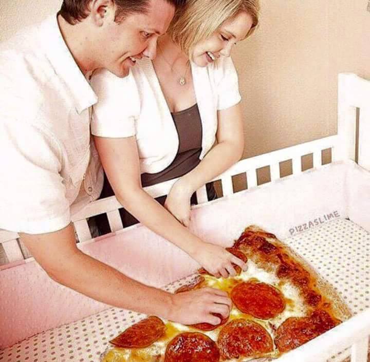 couple admiring their brand new slice of pizza
