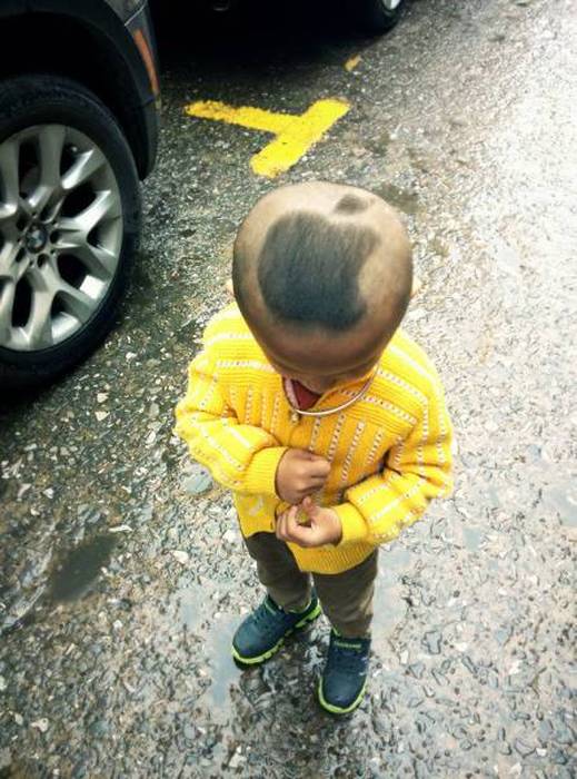 apple logo in hair of child in asia
