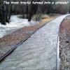 the train tracks turned into a stream