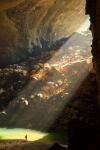 sunlight shining into a giant cave opening, nature