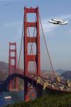 space shuttle being flown closer to space by a 747 over the golden gate bridge