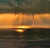 triple waterspout in the sunset
