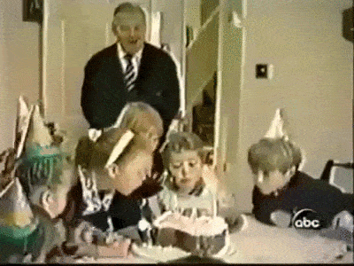table collapses under the weight of kids blowing out birthday candles on cake