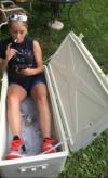 how to really chill out, girl sitting in a beer cooler full of ice and beer