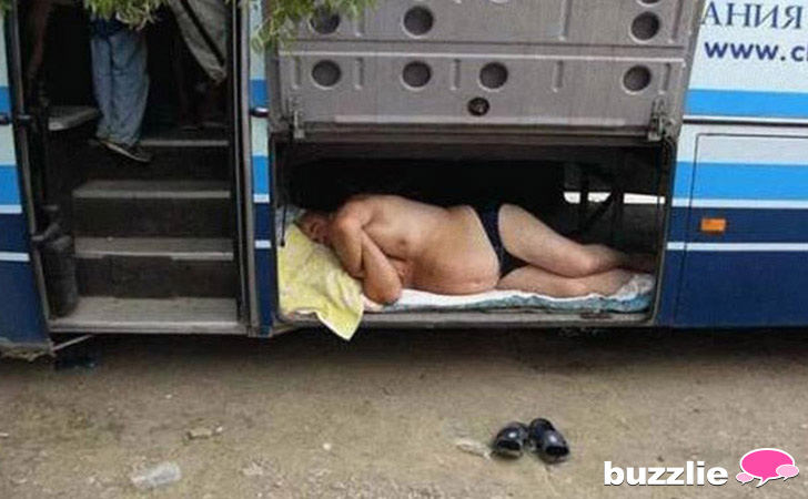 guy sleeping in his underwear in bus luggage compartment, wtf