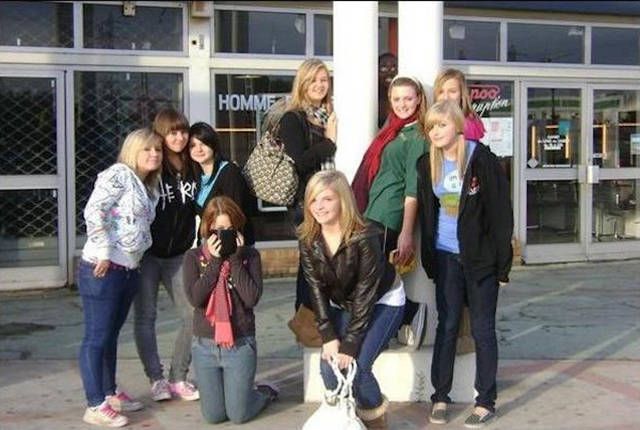 a group of girls pose for a photo, when you see it